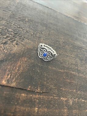 Ornate Silver Ring with Blue Teardrop Stone